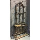 A cast iron hall or coat stand in the late Victorian aesthetic style, possibly a re-cast, the arched