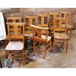 A set of eight beech church chairs each with prayer or hymn book boxes. (8)