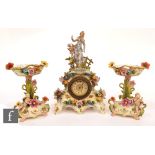 A late 19th Century continental hard paste porcelain clock garniture decorated with a female figure,