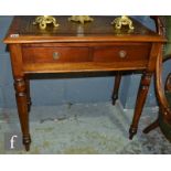 A small Victorian two drawer writing table on turned legs below a tooled leather inset top, height