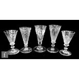 Five assorted 18th Century ale glasses to include two with wrythen bowls, an example engraved with