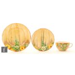 A Clarice Cliff Jonquil pattern Globe shape trio circa 1933 comprising cup, saucer and side plate
