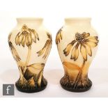 A pair of Moorcroft Pottery vases of inverted baluster form decorated in the Cornflower pattern,