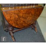 A Victorian figured walnut oval Sutherland table on splayed supports united by a turned stretcher,
