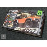 An Axial 1:10 scale AX90021 SCX10 electric four wheel drive truck model kit with Dingo body, boxed.