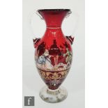 An early 20th Century Venetian ruby glass vase of ovoid form with everted rim, with applied clear
