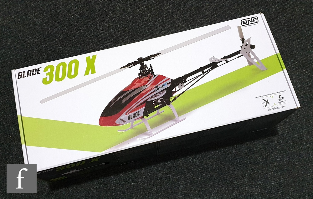 A Horizon Hobby Bind-N-Fly Blade 300X radio control helicopter, boxed.