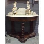 A Victorian mahogany demi-lune marble top washstand with spiral central support on a platform