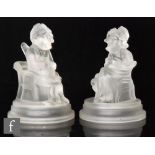 A pair of late 19th Century novelty Mr Punch & Judy figures by John Derbyshire, both figures seated,