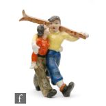 A 1930s Keramos model of skiers, the lady and gentleman with arms at each others waist, he holding a