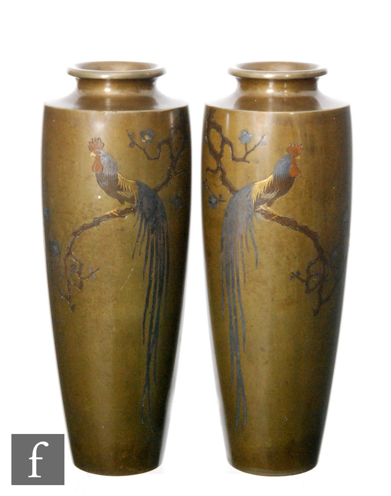 A pair of late 19th Century Japanese Meji period inlaid bronze cylindrical vases of tapering form