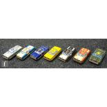 A collection of seven unboxed Japanese friction drive tinplate cars by Nakamura, comprising police