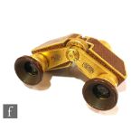 A pair of 1930s Carl Zeiss Jena Theatis opera glasses, serial number 1481170, with snake skin