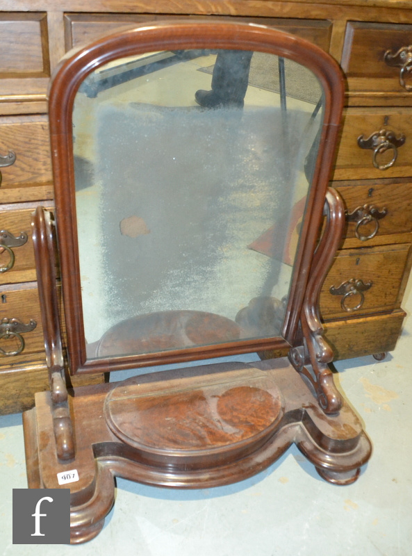 A Victorian mahogany swing toilet mirror with lift base trinket compartment, width 67cm.