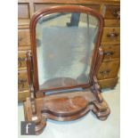 A Victorian mahogany swing toilet mirror with lift base trinket compartment, width 67cm.