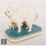 A 19th Century Minton posy vase modelled as a cat and her kitten stood upon a turquoise glaze