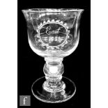 A late Georgian coin goblet with large waisted ovoid bowl engraved 'East 1821', above a hollow blown