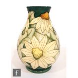 A Moorcroft Pottery vase decorated in the Summer Lawn pattern designed by Rachel Bishop, printed and