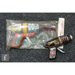 A Japanese Haji Toys Atomic Gun tinplate toy ray gun in polythene bag with header card, together