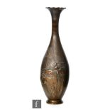 An early 20th Century Chinese bronze vase of pear form, rising to a slender neck with scalloped rim,