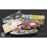 Assorted toys to include a boxed Scalex 415S Speed Boat, a Triang Ocean Merchant boat, another