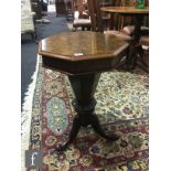 A Victorian mahogany octagonal sewing table, fitted interior, on tripod legs and castors, height