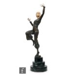 A reproduction figure in the Art Deco style, modelled as a lady in dancing pose wearing a trouser