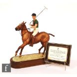 A Royal Worcester model of H.R.H The Duke of Edinburgh upon a polo horse, modelled by Doris Lindner,