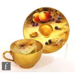 A Royal Worcester Fallen Fruits cabinet cup and saucer decorated by Austin with hand painted apples,