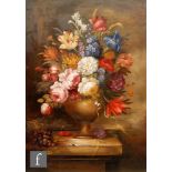 E. M. BALL (CONTEMPORARY) - Flowers in an urn on a stone ledge, oil on board, signed, framed, 45cm x