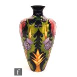 A Moorcroft Pottery vase decorated in the Rose, Thistle and Shamrock pattern, designed by Nicola