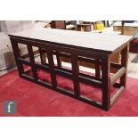A 20th Century large oak alter table, the plank top over champhered block feet and rails supports,