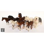 A collection of five Beswick horses of varying form, together with two Royal Doulton horses and a
