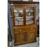 A 19th Century satinwood banded secretaire mahogany bookcase enclosed by a pair of astragal glazed