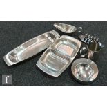 A collection of assorted Robert Welch Old Hall stainless steel to include nut dishes, toast rack and