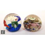 A 20th Century Italian scramble glass paperweight containing millefiori canes, lattachino canes