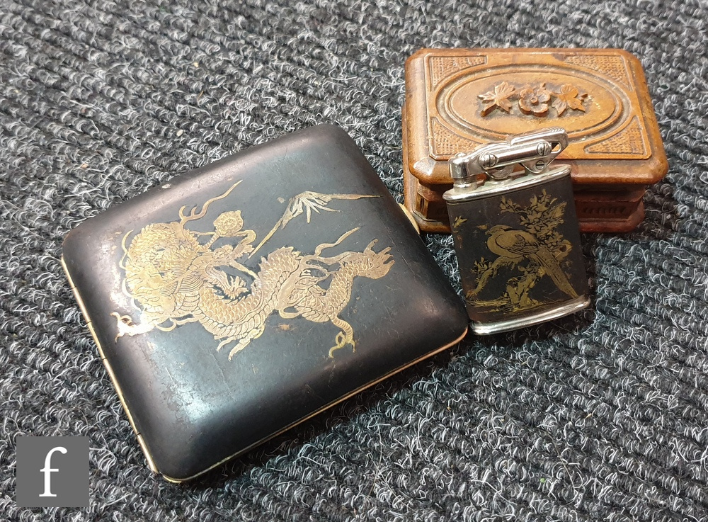 A 1930s lady's cigarette case decorated with a chasing dragon and Mount Fuji, a matching lighter and