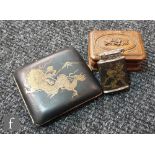 A 1930s lady's cigarette case decorated with a chasing dragon and Mount Fuji, a matching lighter and