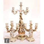 A late 19th Century continental hard paste porcelain candelabra with a four light sconce above a