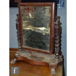 A Victorian mahogany swing toilet mirror on claw feet and a similar toilet mirror on spiral