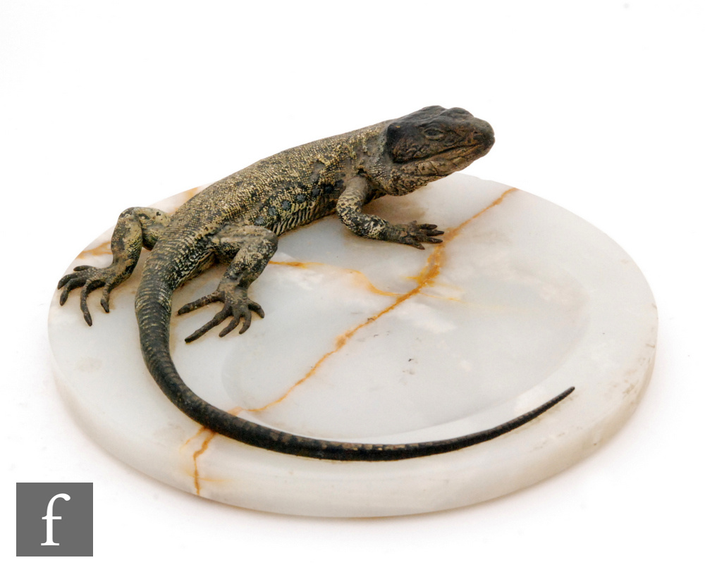 Bergman - An early 20th Century painted cold cast bronze lizard mounted on an onyx base, unmarked,