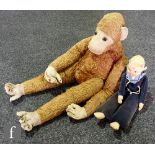A Schuco monkey pyjama case, golden mohair with felt face, hands and feet, length 70cm, together