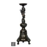 A late 19th Century Japanese Meiji period bronze incense stand of circular bulbous form entwined