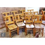 A set of ten beech church chairs each with prayer or hymn book boxes. (10)