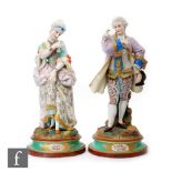 A pair of 19th Century French tinted bisque figures depicting a lady and gentleman in period dress