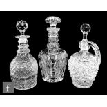 An early 20th Century clear cut crystal decanter with diamond, panel and fan cuts below a three ring