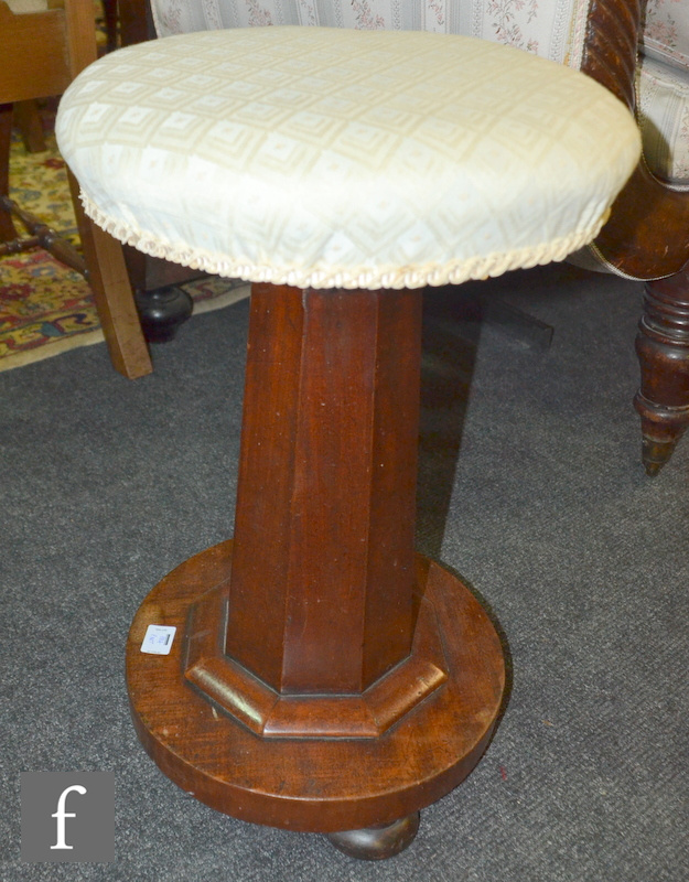 An early 20th Century tilt top combination firescreen occasional table with tapestry panel, together