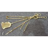 A set of three brass fire irons and matching tongs. (4)