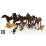 A collection of assorted Beswick and Royal Doulton animals to include horse, dogs and a brandy glass