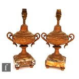 A pair of Louis XI style gilt metal lamp bases, each raised on toupee feet, modelled as a campana